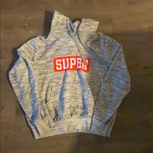 Grey sweater that says super